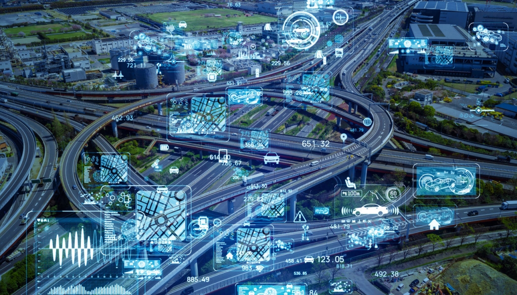 A junction on a big highway and in the image we see several digital simulations of navigation and data interface.